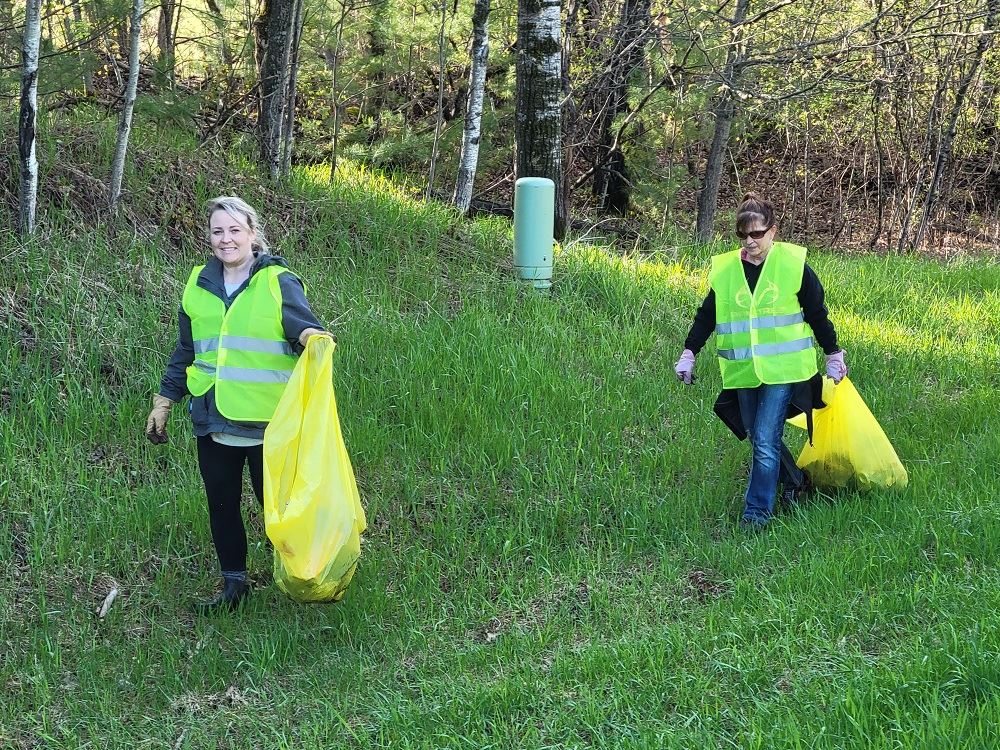 Unity Bank crew picking up trash in ditch 