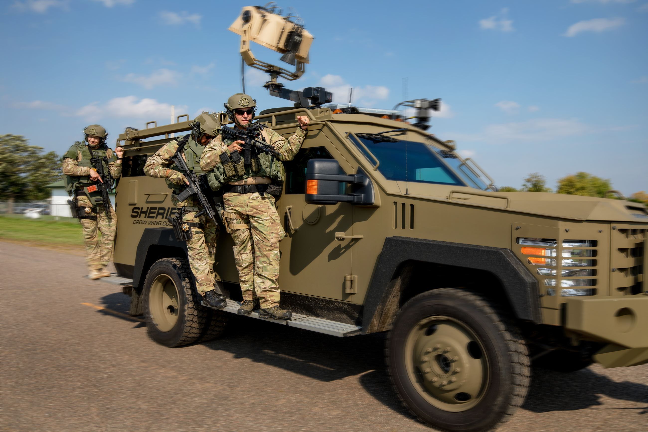 Members of the Tactical Team riding on specialty equipment